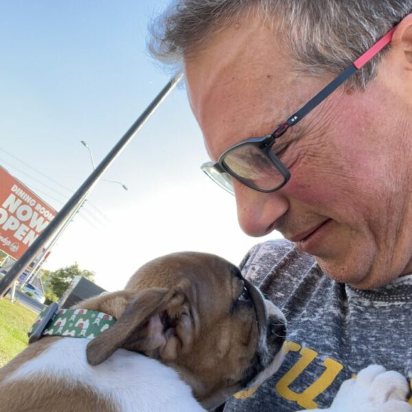 Eight week old puppy and new owner bonding